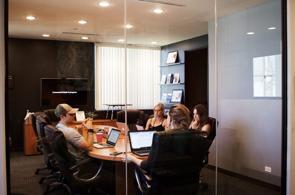 Employees hold a meeting in a conference room in Malta.