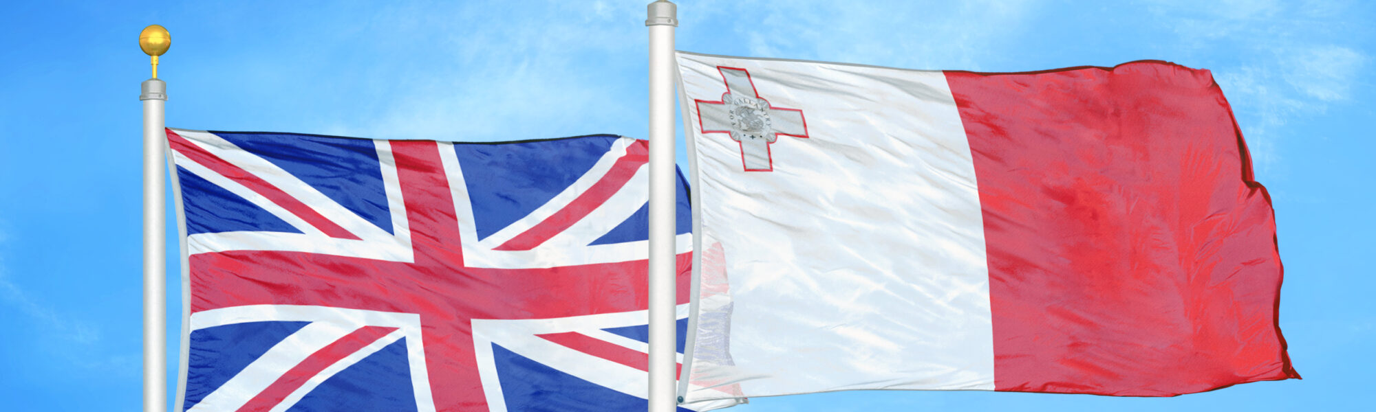 UK and Maltese flags flying