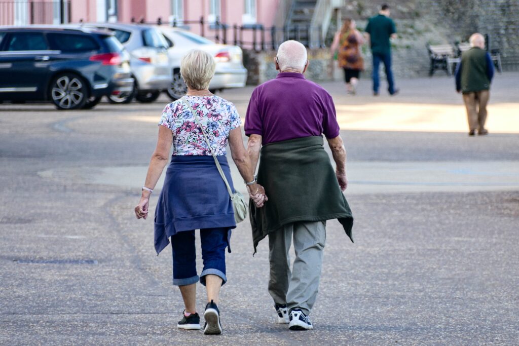 Retired Couple Holding Hands