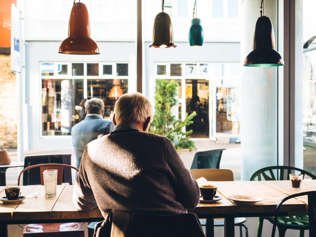 Senior in a Maltese Cafe